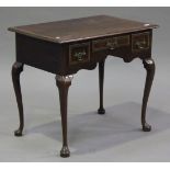 An 18th century walnut lowboy with crossbanded decoration, the moulded top above three frieze