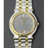 A Gucci gilt metal and steel bracelet wristwatch, the signed circular dial with gilt baton shaped