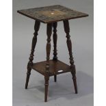 A late Victorian Arts and Crafts style mahogany square two-tier occasional table, carved with floral