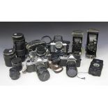 Three Pentax K1000 cameras, two with 1:3 5-4.5 28-80mm lens, the other with 1:2.8 28mm lens, a