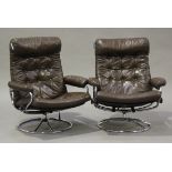 A pair of mid-20th century chromium plated tubular metal and buttoned brown leather reclining