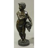 A large late 20th century brown patinated cast bronze figure of a putto holding an upturned urn of