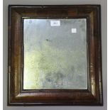 A 19th century Queen Anne style walnut rectangular wall mirror with a wide cushion moulded frame,