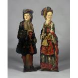 A pair of late 19th century painted softwood dummy boards, decorated as a lady and gentleman dressed