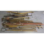 A quantity of mainly early 20th century gardening tools, including a hay fork, three other forks,