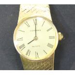 A Longines Quartz 9ct gold lady's bracelet wristwatch, the signed circular gilt dial with black
