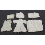 A small collection of early 20th century infants' clothes, including a christening jacket,