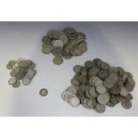 A collection of British pre-decimal, pre-1947 currency, comprising half-crowns, florins and