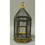 A large 20th century patinated wooden and wirework hexagonal birdcage, height 115cm.