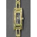 A Gucci gilt metal lady's bracelet wristwatch, the signed rectangular dial with gilt hands, on a