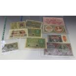 A small collection of eleven European banknotes, mostly Austria and Germany, including two fifty