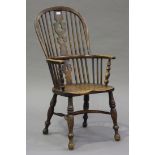 A Victorian ash and elm Windsor armchair, the pierced splat and spindle back above a solid seat,