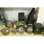 A group of various copper pans, a copper funnel, a pair of early 20th century churn-shaped double-