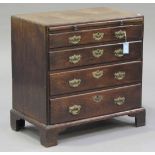 A George III mahogany bachelor's chest of four graduated long drawers, the brushing slide above