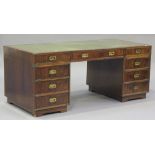 A 20th century reproduction mahogany twin pedestal desk, the top inset with green tooled leather