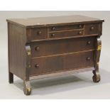 A late 19th/early 20th Century French walnut commode, fitted with four short and two long drawers,