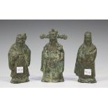 A group of three 20th century Chinese green patinated cast bronze figures of sages, heights 14cm.