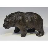 A late 19th century Black Forest carved softwood model of a bear, length 16.5cm.