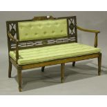 An Edwardian Neoclassical Revival satinwood and painted settee, the buttoned back with openwork