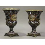 A pair of modern ceramic and cast metal mounted urns, each campana shaped body painted with oval