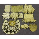 A group of various textiles, including a crochet work bag, a pair of gilt thread embroidered panels,