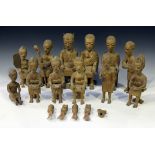 A group of mid-20th century African carved wooden figures resembling a tribal court scene, height of