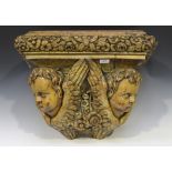 A 19th century Continental carved softwood wall bracket planter, the top inset with a tin liner