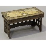 A Singaporean hardwood rectangular tea table, carved with dragons and script, height 34cm, width