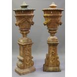 A large pair of late 20th century terracotta effect moulded composition garden urns and covers, each