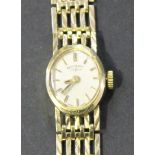 A Rotary 9ct gold lady's bracelet wristwatch, the signed oval dial with baton shaped numerals, on
