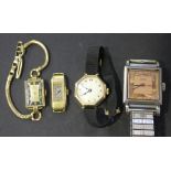 A Dogma 14ct gold rectangular cased lady's wristwatch, the case detailed '14K 0.585', on a gilt