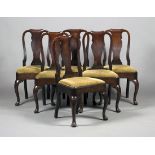 A set of six Queen Anne walnut vase back dining chairs, the drop-in seats upholstered in green