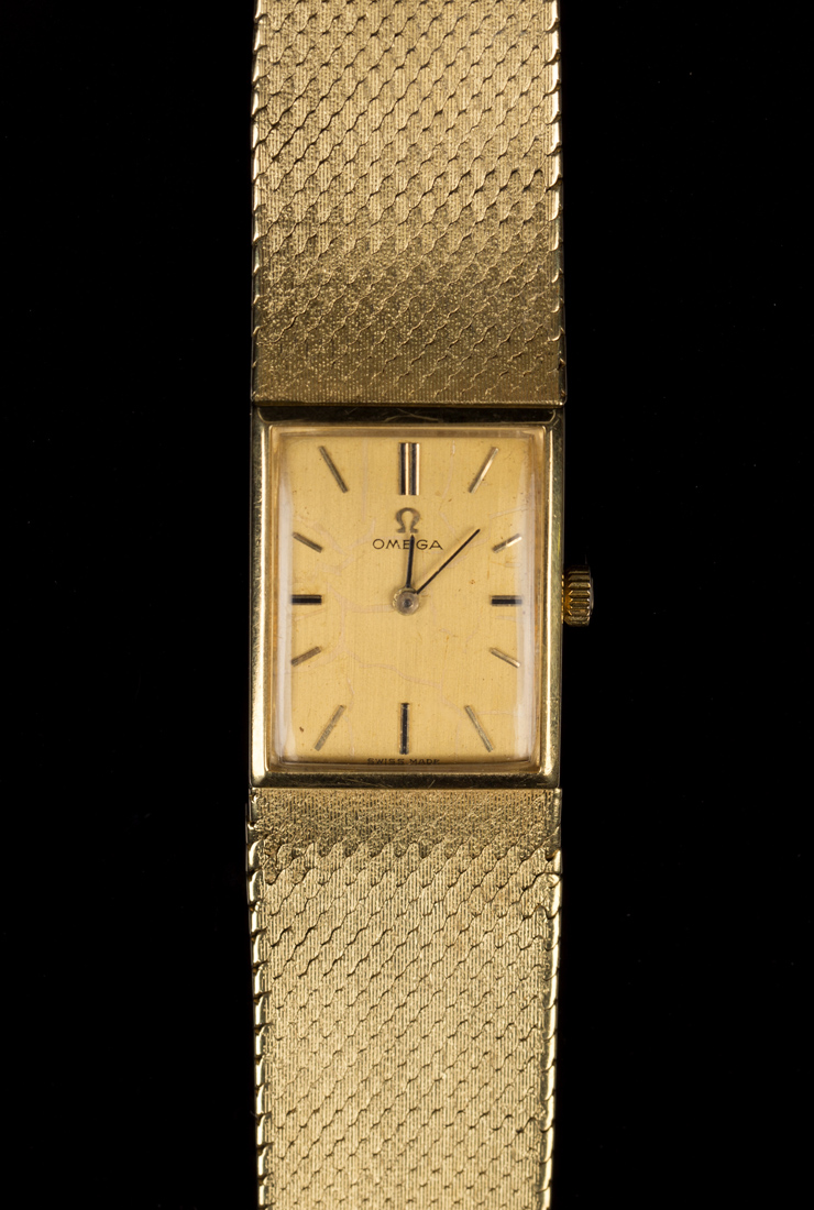 An Omega 18ct gold rectangular cased gentleman's bracelet wristwatch with a signed circular jewelled