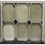 A set of four late 19th century white painted astragal glazed windows, each inset with painted