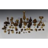 A large collection of modern turned and carved treen items, including vases, bowls and
