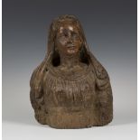 A Northern European carved softwood head and shoulders bust of a lady, probably early 18th
