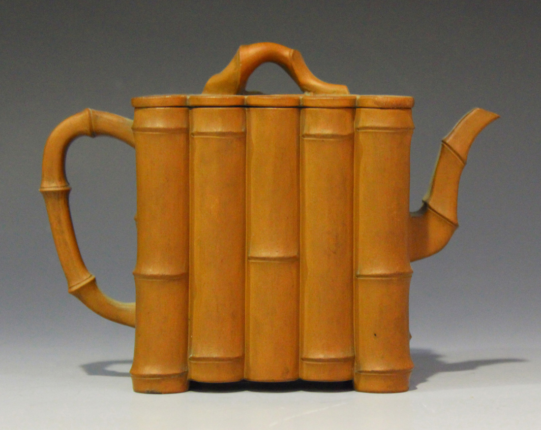 A Chinese Yixing stoneware teapot and cover, late Qing dynasty, of bamboo moulded rectangular