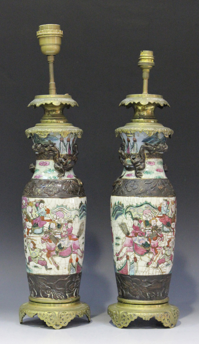 A pair of Chinese famille rose crackle glazed porcelain vases, late 19th century, with brass table