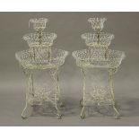 A pair of late 19th/early 20th century wirework three-tier plant stands of circular form, height