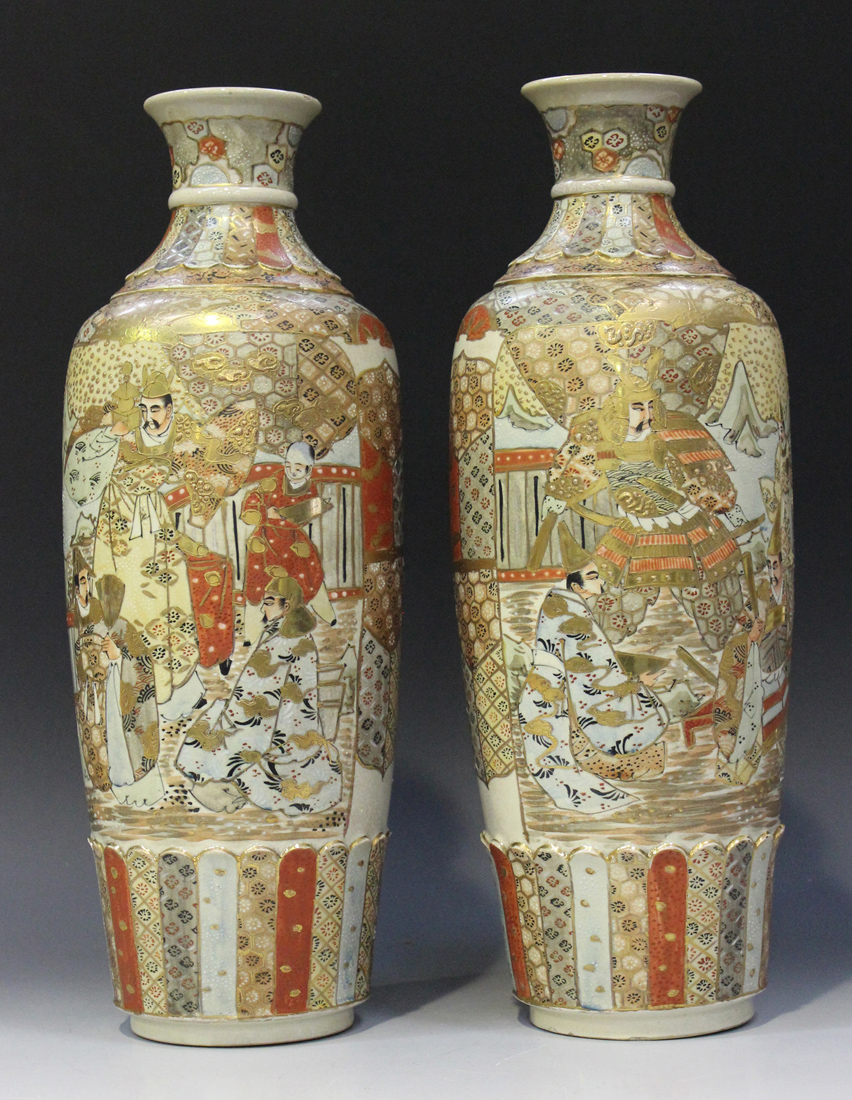 A pair of Japanese Satsuma earthenware vases, Meiji period, each of slender shouldered tapering