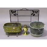 A late 19th century Dutch brass planter of curved form, the body with embossed fleur-de-lis and