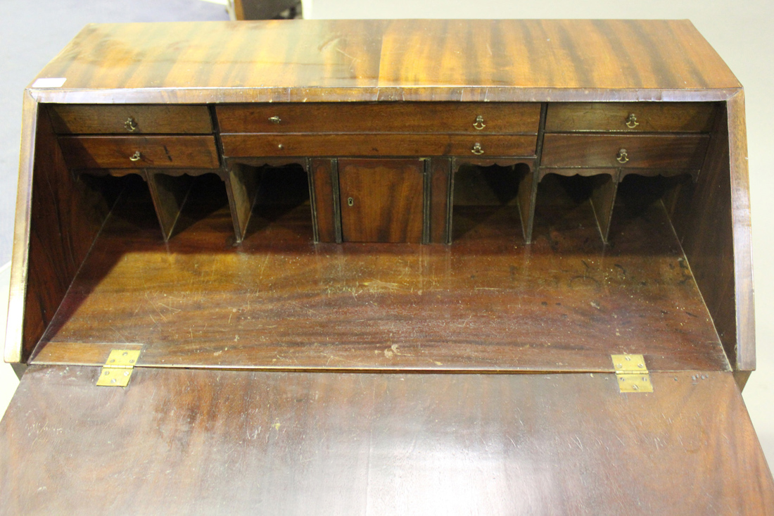 A late George III figured mahogany bureau, the fall flap above four long drawers, on bracket feet, - Image 2 of 2