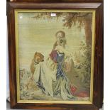 A 19th century petit point woolwork panel of two ladies and a dog seated within a landscape, 72cm