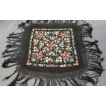Two Chinese black silk embroidered shawls, early 20th century, each finely worked in coloured