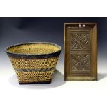 An African leather and wicker woven basket, height 29cm, together with a chip carved rectangular