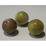 A group of three 19th century turned ivory billiard balls, diameter of one 5cm, diameter of two 4.