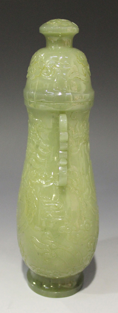 A Chinese celadon jade pear form vase and cover, late Qing dynasty, finely hollowed and carved in - Image 2 of 8
