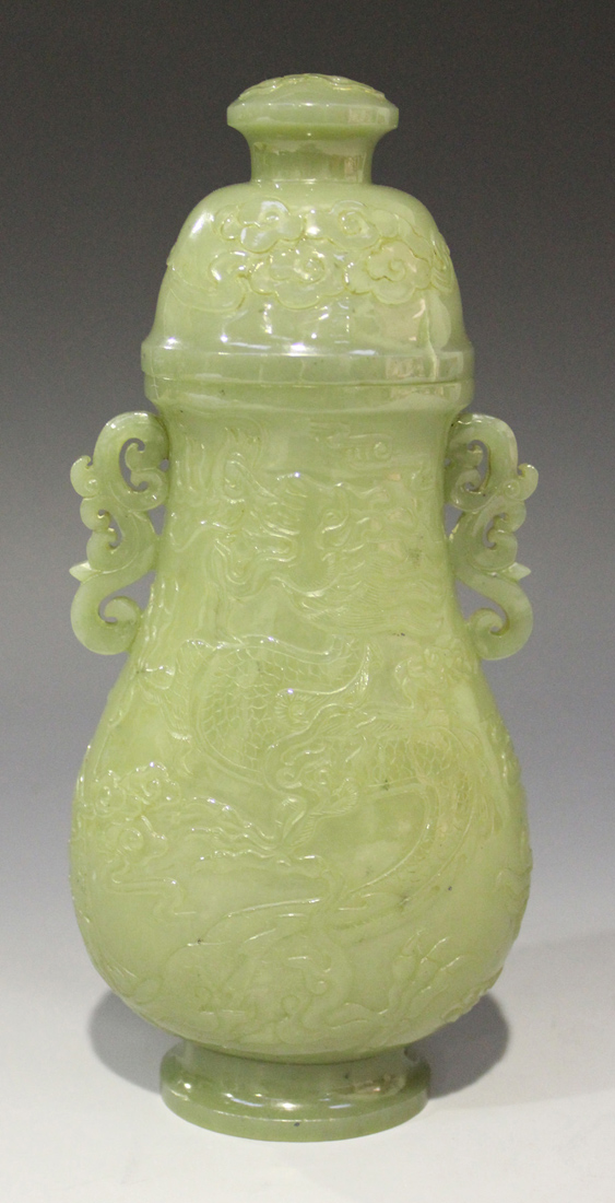 A Chinese celadon jade pear form vase and cover, late Qing dynasty, finely hollowed and carved in - Image 3 of 8