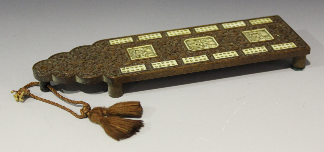 A Chinese Canton sandalwood and ivory cribbage board, mid-19th century, carved in relief with a