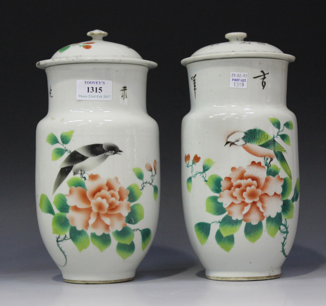 A pair of Chinese porcelain jars and covers, 20th century, each decorated with bird and peony